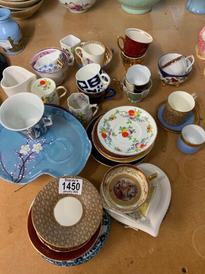A collection of cabinet cups and saucers.