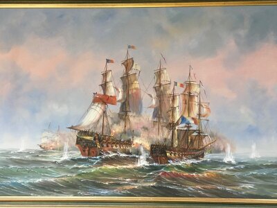 A 20th century oil on canvas painting of two Galleons at battle, signed Wisselingh. Frame dimensions 98x68cm