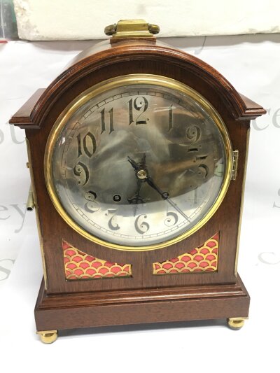 A late 19th Century mahogany 8 day bracket clock with Arabic numerals on a silvered dial, approx height 40cm.