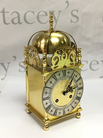 A brass lantern type clock, approx height 24cm.