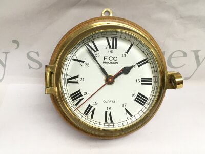 A Quartz brass cased ship's clock.