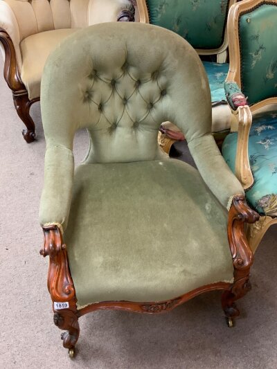A small Victorian button backed upholstered tub chair.