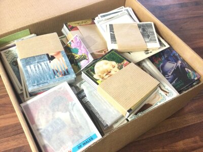 A box containing a large quantity of sets of collectors cards Sporting time card company ABC cards Candystick cards Splitting image cards and many more