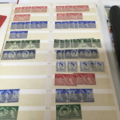 A collection of four albums of stamps including an album of unused Elizabeth II pre decimal stamps an album of Mint unused Channel Island stamps and two albums of British Pictorial stamps (4)