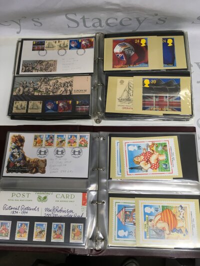 A box of first day covers and presentation packs.