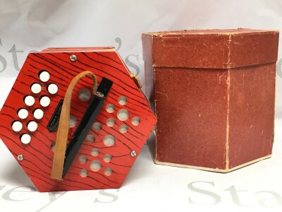 A vintage boxed German concerting squeeze box