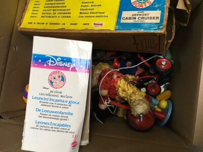 A collection of vintage playworn toys including a Furby, Action man, Khoner bros xylophone Mickey Mouse puppet ,boxed Disney mugs, Snow White dwarfs hygienic toys by Chad Valley, boxed snow white block puzzle etc