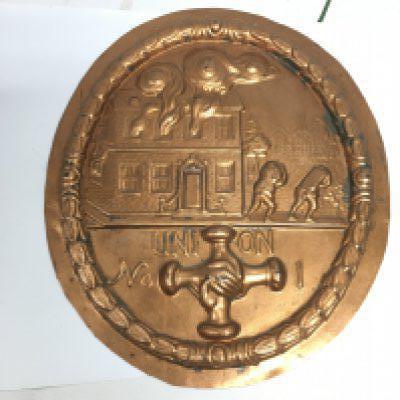 A copper fire plaque, approx width 18.5cm. NO RESERVE