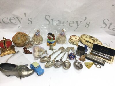 A collection of items including spoons, harmonicas etc