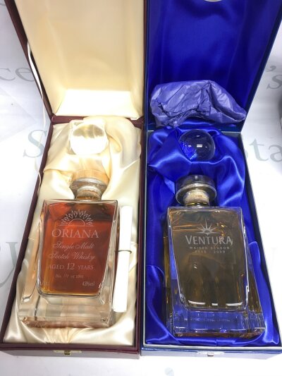 Two boxed cruise liner single malt whiskey decanters, both sealed and full.