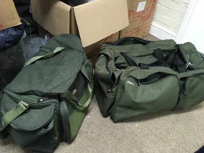 A collection of fishing reels including Shakespeare Mack 3, Penn 310, Abu Garcia , Wychwood dispatch 7500 and two bags