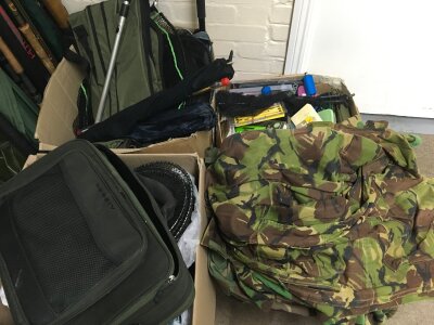 Four boxes of fishing gear including three camouflage shirts, rain coats , bags, tackle, nets etc