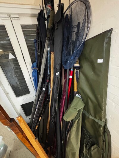 A collection of various fishing rods and accessories