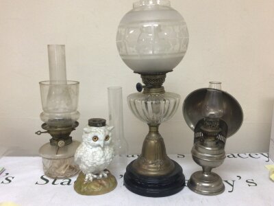 A late Victorian oil lamp with acid etched shade a ceramic oil lamp base in the form of an owl and other oil lamps and accessories.