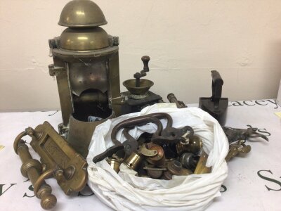 A collection of brass fittings an antique letter box door handles furniture fittings casters handles a coffee grinder large lamp figures and other oddments. NO RESERVE.