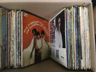 A box of LPs by various artists comprising mainly Elvis Presley titles.