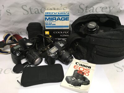 A collection of cameras, lenses and accessories.