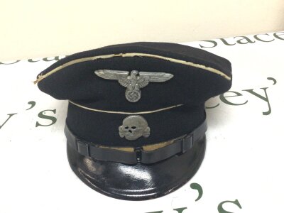 A German Third Reich original Allgemeind SS NCO peaked cap SS marked on the inside of the peak and with SS RMZ label original condition.