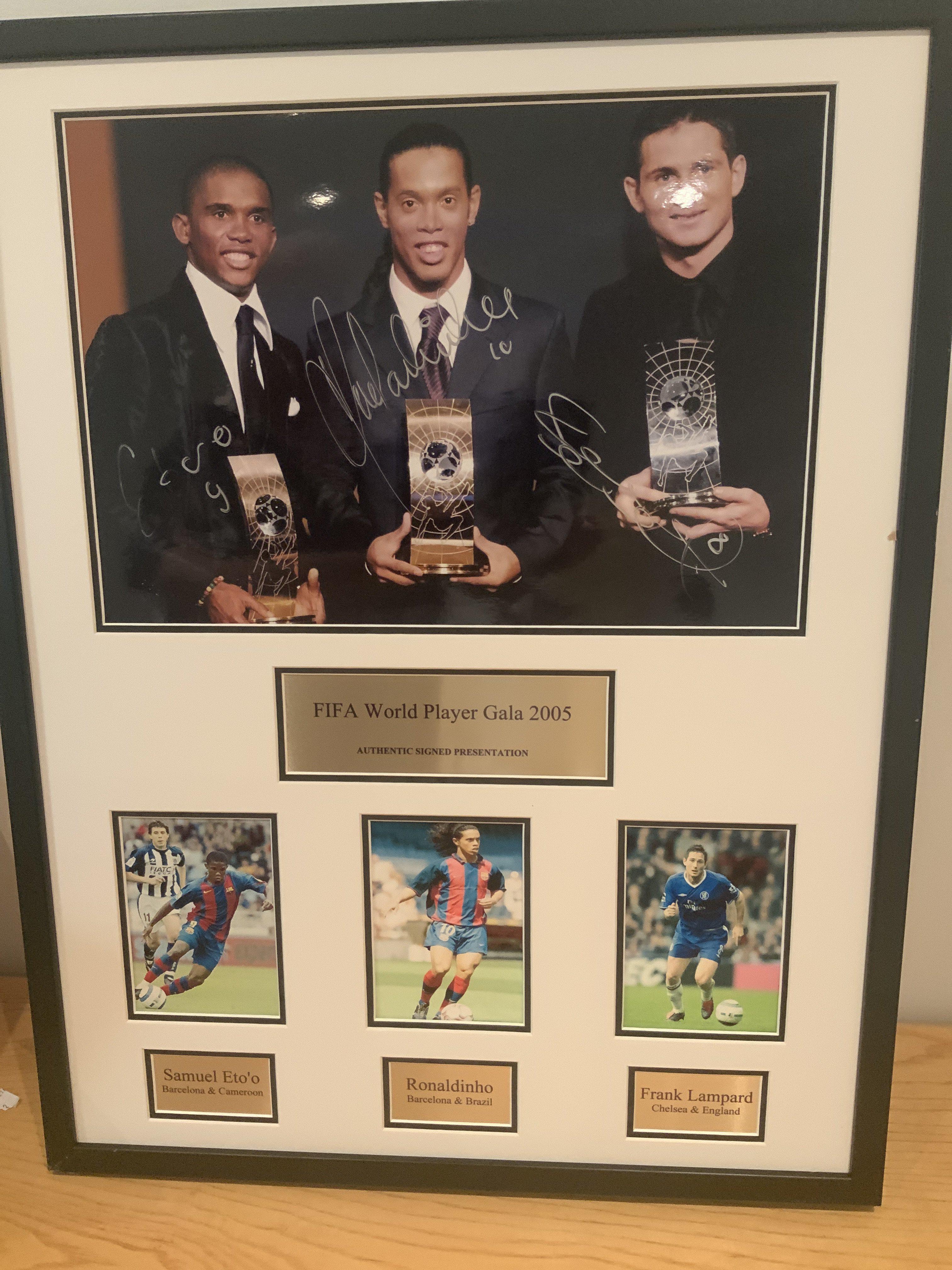 Ronaldinho Eto + Lampard Signed Football Display: Framed unglazed display with photo of the 2005 FIFA Presentation for the World Player of the Year. The event was held on the 19 December 2005 at the Zurich opera house. The winner was Ronaldinho. Signed by all 3 on main photo with photos underneath showing players in club kit.