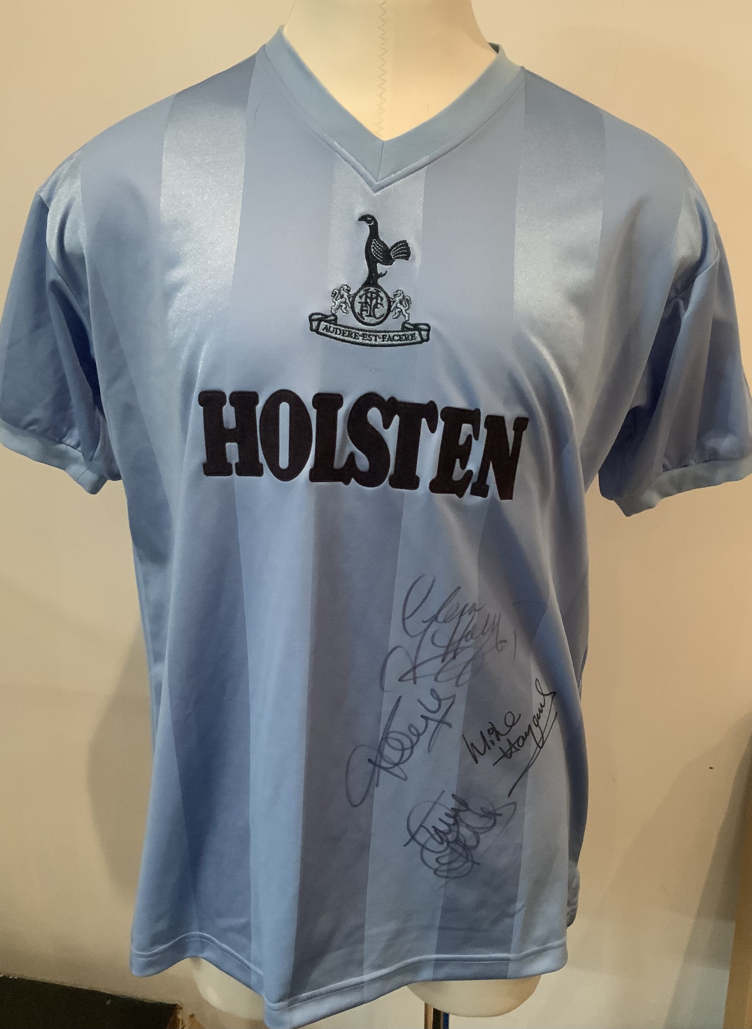 Tottenham Football Shirts: Holsten remake signed by Hoddle Hazard and two others, Two home shirts one signed by Ledley King, Two older kids shirts in lesser condition and two books signed by Greaves and Ginola.