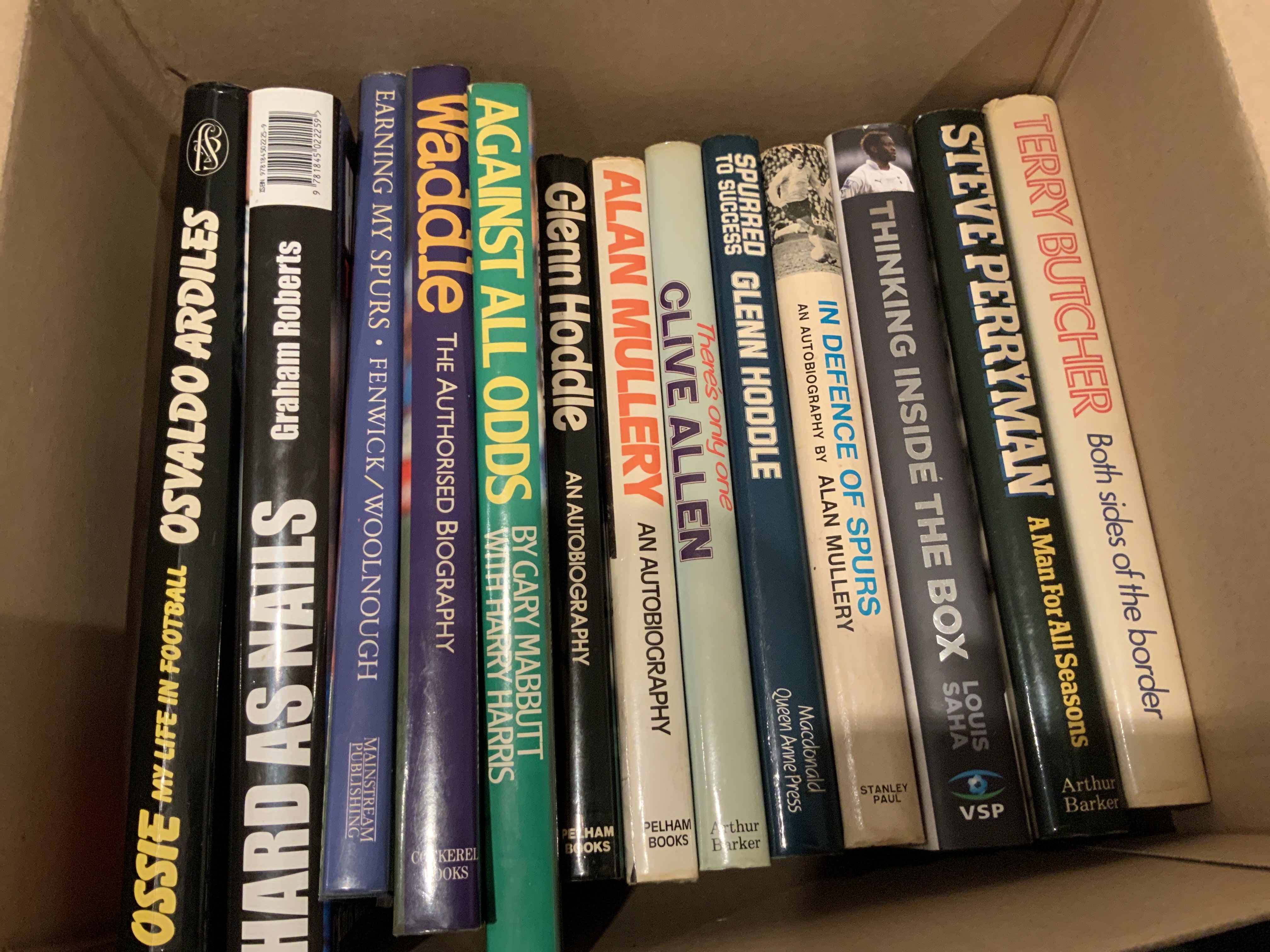 Tottenham Signed Football Book Collection: Autographed undedicated books by Ardiles, Roberts, Waddle, Mabbutt, 2 different Mullery, Allen and Hoddle. Dedicated books of Fenwick, Hoddle and Perryman. C/W undedicated signed books of Saha and Butcher. (13)