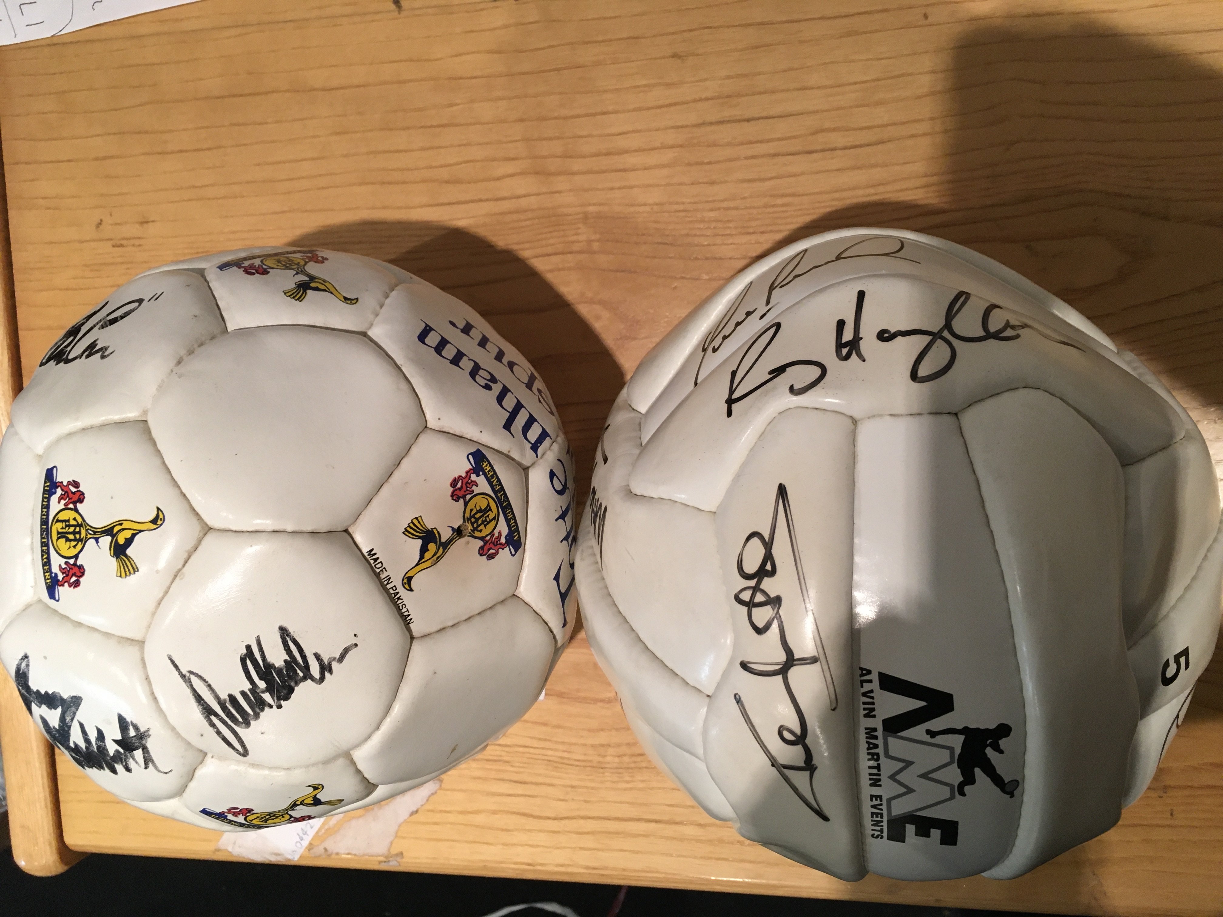 Tottenham Signed Football: Spurs ball won at a charity Spurs legends match with autographs including Anderton Ferdinand Carr Mabbutt and others. Collection of Spurs Corinthian figures included. C/W a signed football from Alvin Martin Events with signatures of McAvennie Neal Parker Houghton Martin Cottee and others. (2)