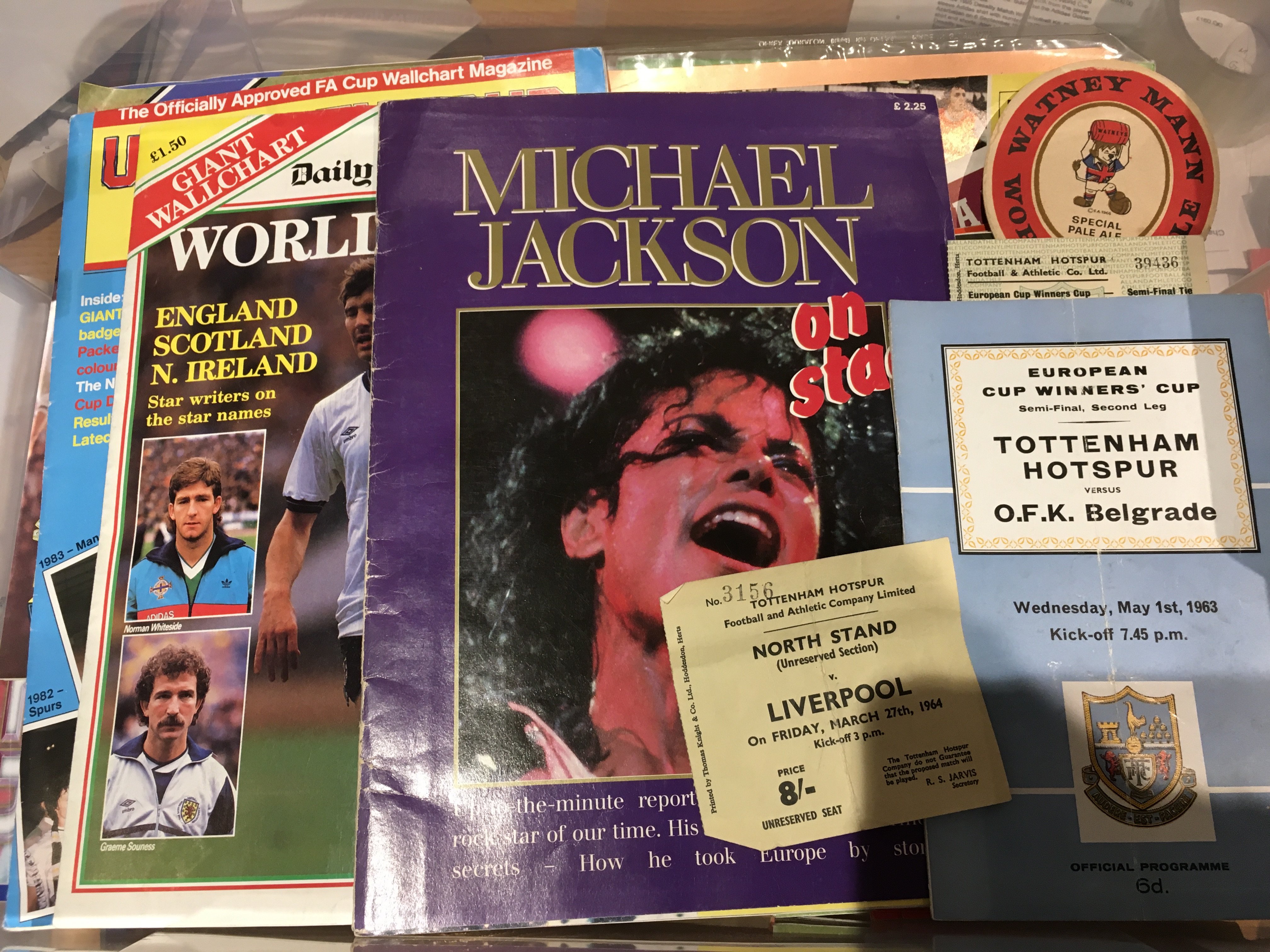 Football Programmes + Memorabilia: Quantity with many from the 60s to include good Tottenham and big match content. Spotted a few tickets to include Spurs 60s and England. C/W WC Willie beer mat, wall charts, coin set and some single sheets. (box)