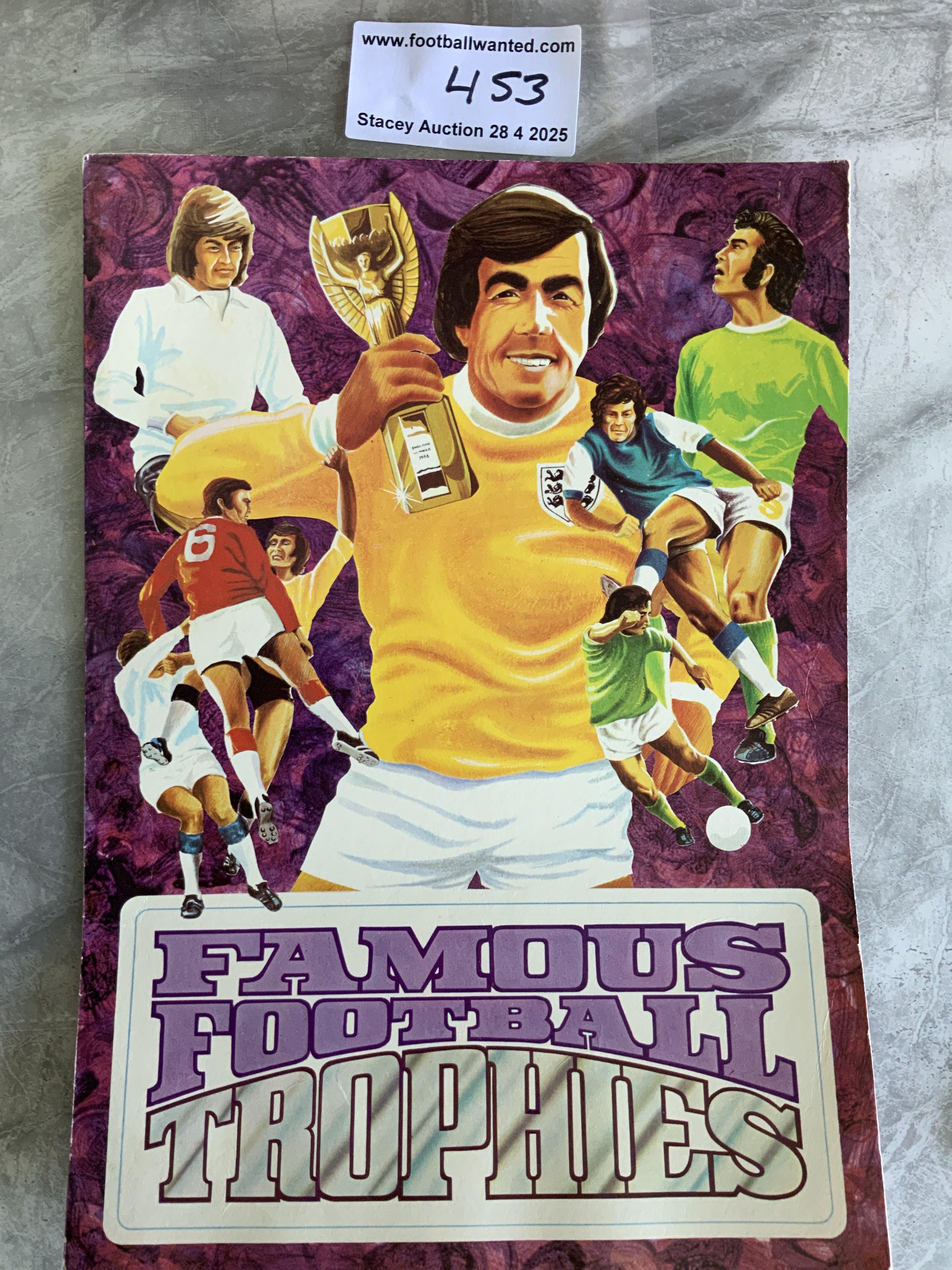 Burmah Oil Famous Football Trophies: Rare set featuring Gordon Banks holding the World Cup to cover of empty album. In each original packet is a full set of the 12 trophies which are not stuck into album.
