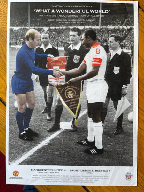 1968 European Cup Final Manchester United Football Print: 31 x 22 inch quality Becket print depicting the captains exchanging pennants at Wembley. Given to a member of the Association of Manchester United Former players. Hard to obtain unsigned poster with quote from Bobby Charlton.
