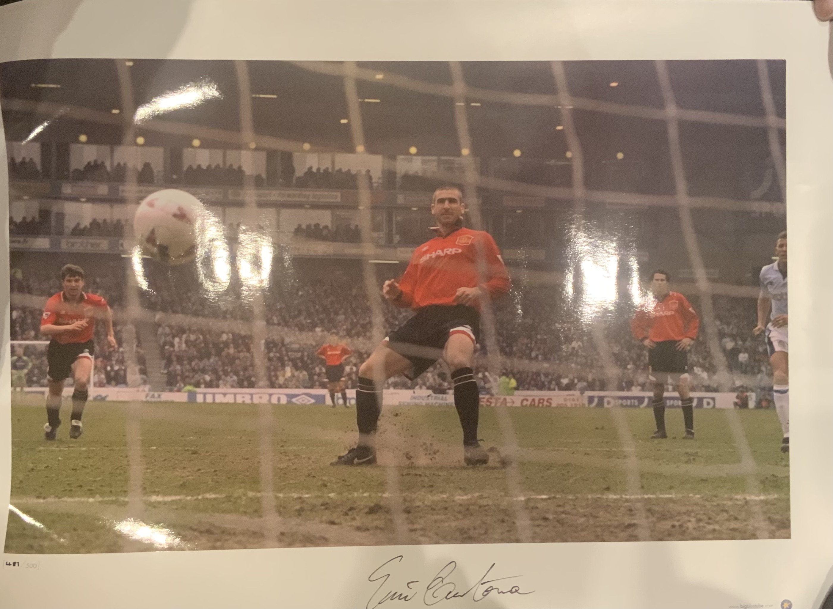 Manchester United Big Blue Tube Signed Football Prints: All measuring nearly 23 x 17 inches in excellent condition produced by the famous company with genuine autographs on prints which there are print runs of only 500. Includes two different of Cantona plus Schmeichel, Giggs and Van Nistelrooy. (5)