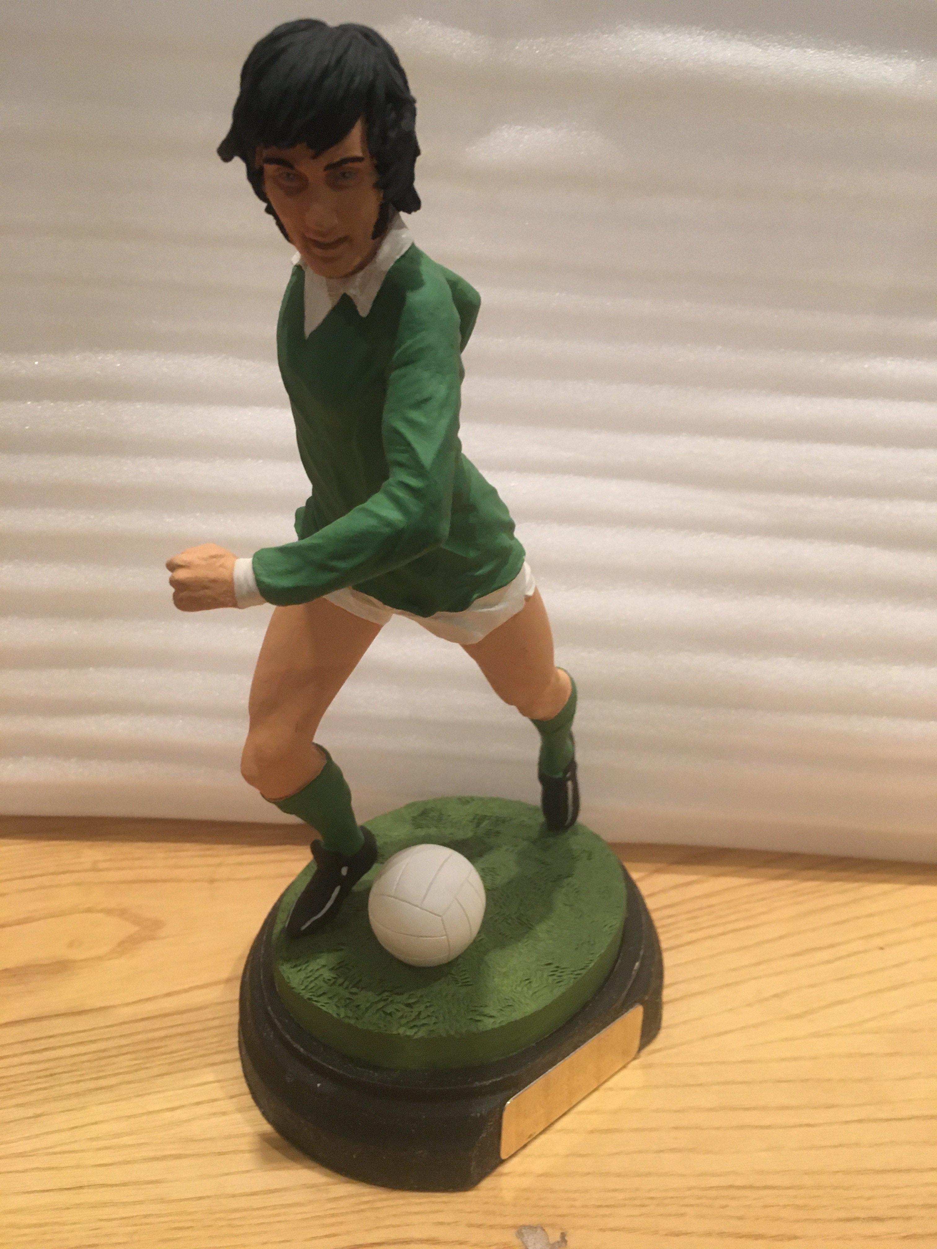 George Best Northern Ireland Football Figure: Excellent lifelike figure featuring Best In Northern Ireland kit wearing number 11. Sitting on base with plaque measuring 9 inches high including base.