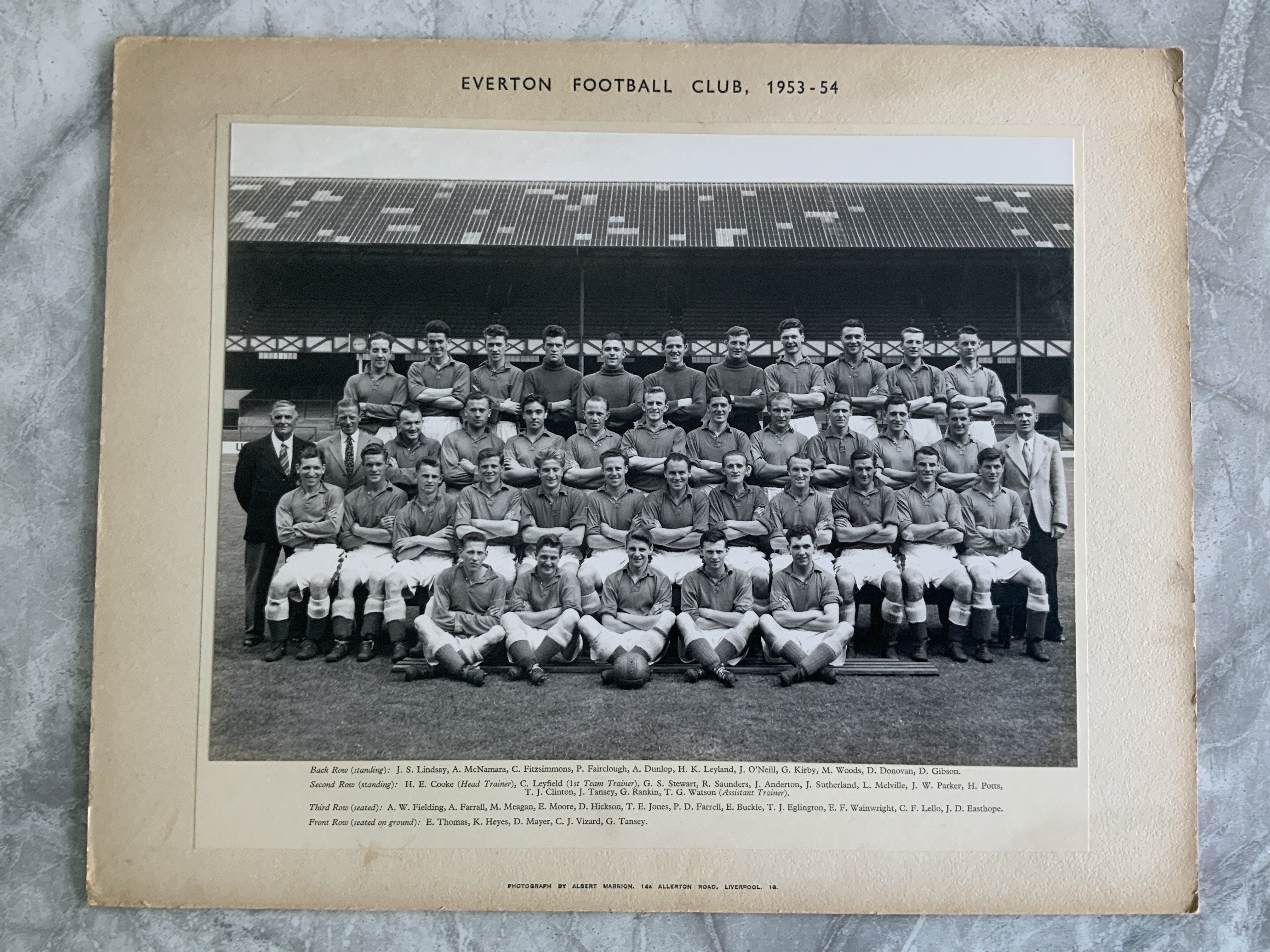Everton 53/54 Official Club Photo: 15 x 12 inch card with photo by Albert Marion attached. Official photo of 41 staff all named to border.