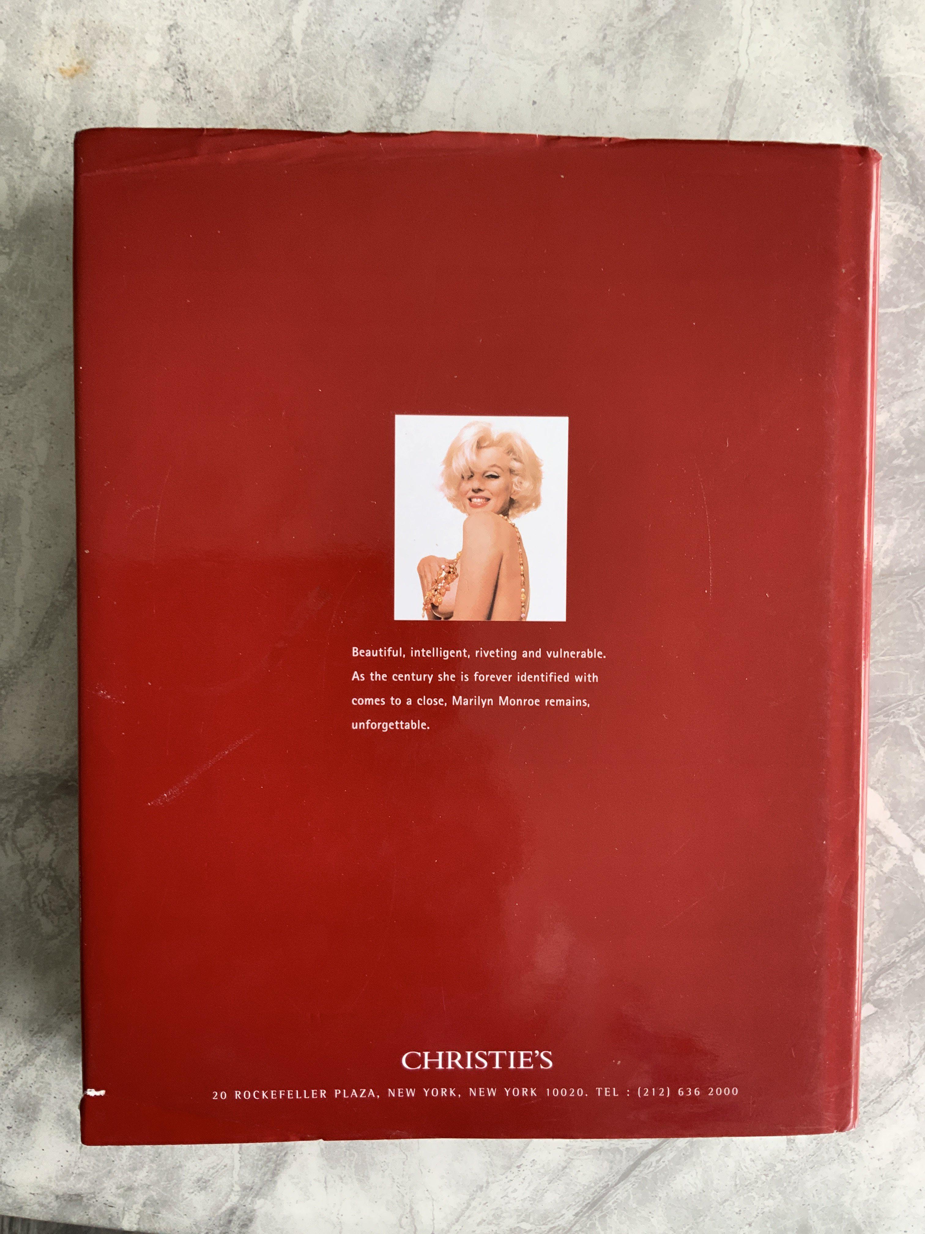 Marilyn Monroe Christies New York Hardback Auction Book: Over 400 pages in this stunning heavy book for the 1999 sale of Marilyn Monroes personal property. Tiny tear to dust jacket rear page.