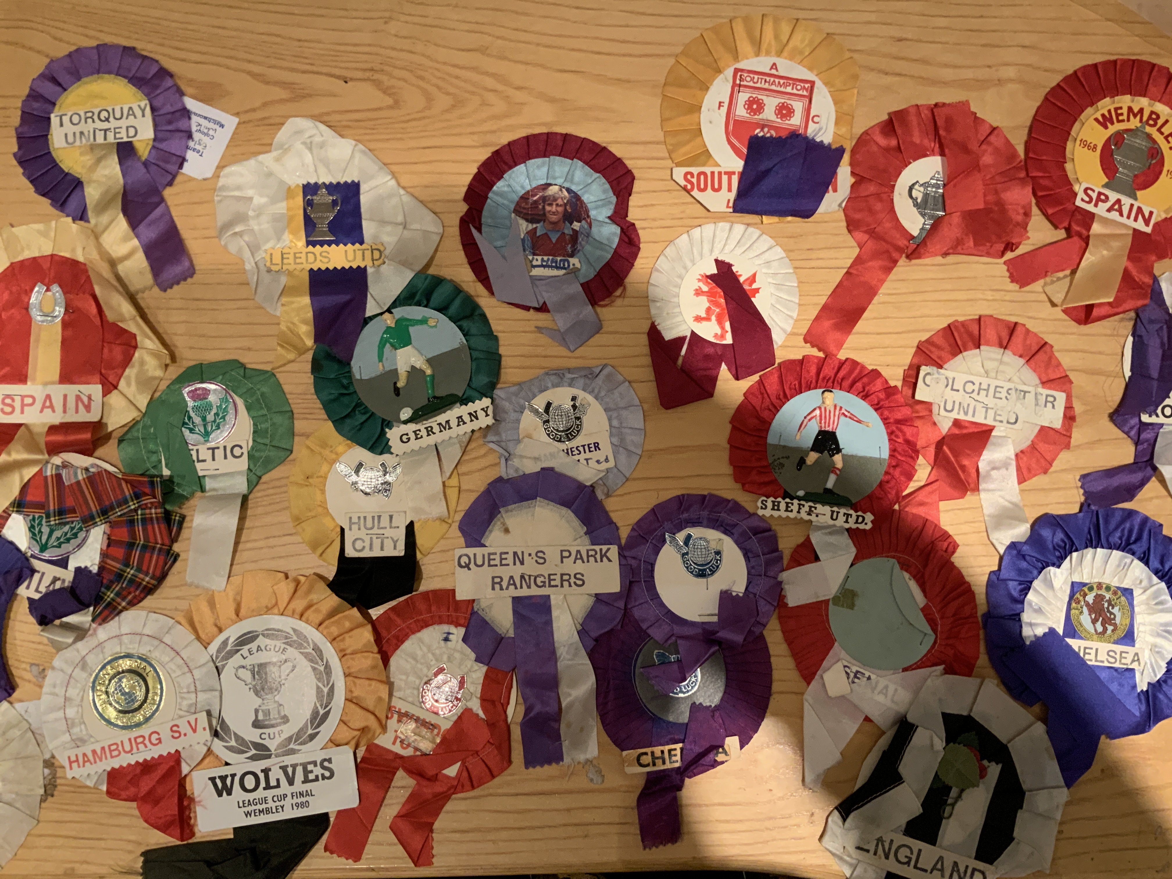 Football Rosette Collection: Wide range of teams mainly from the 70s. Includes QPR Celtic Scotland Germany Sheffield United, Spain 1968 Wolves League Cup Final 1980. Fair condition. (25)