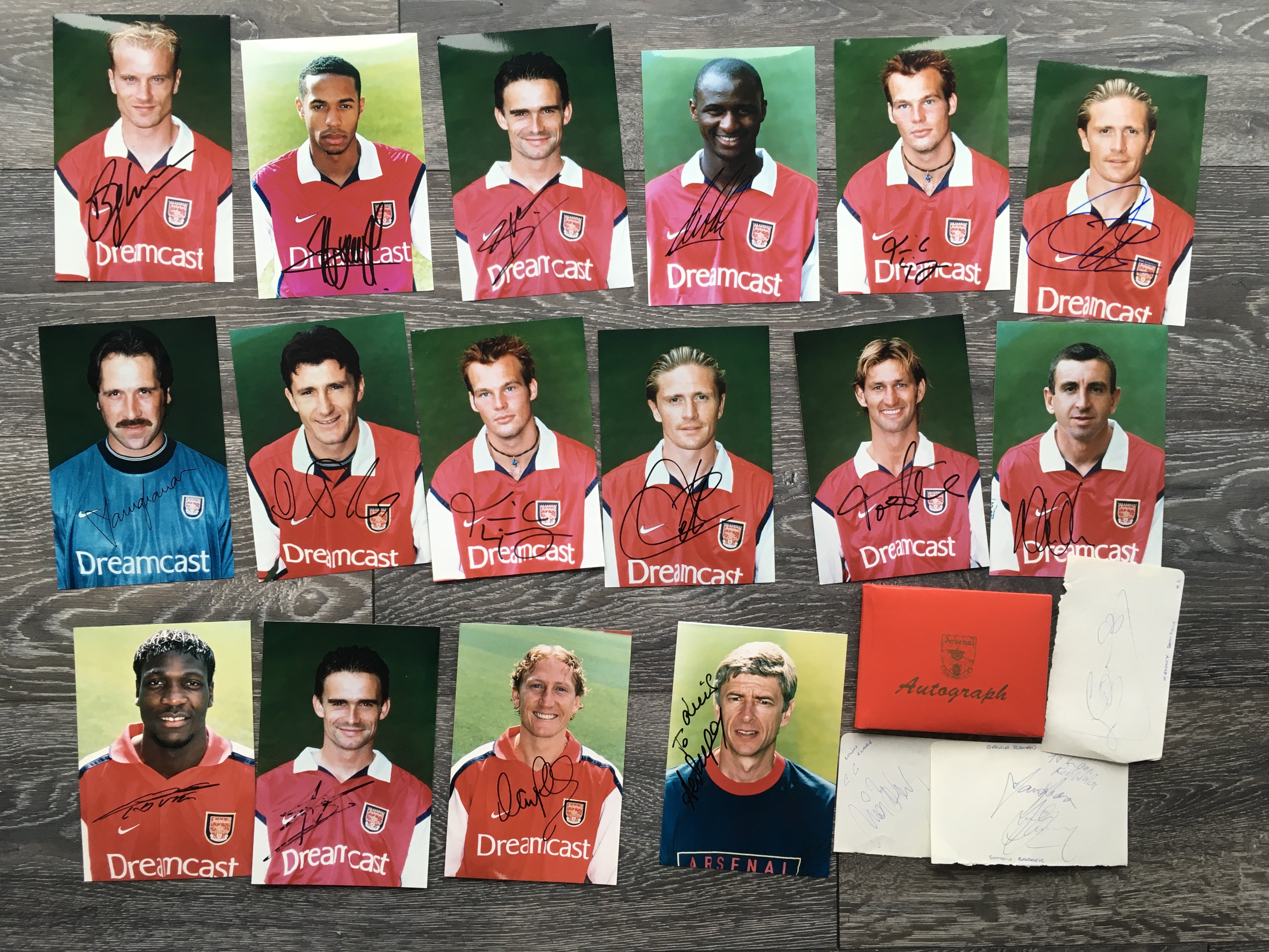 Arsenal Signed Football Photos: Hand signed photos from 2000 - 2002 of individual players to include Parlour Henry Winterburn Adams Petit Suker Seaman Viera Bergkamp Ljungberg and only one dedicated which is Wenger. These were collected personally by vendor of this championship winning team. C/W a framed signed photo of Kanu and an autograph book to include names such as a Wilson Wright Dickov Helder and Platt.