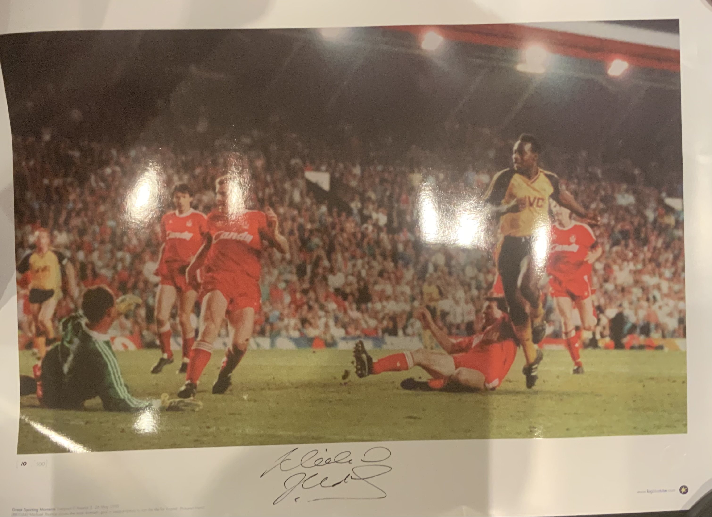 Arsenal Big Blue Tube Signed Football Prints: All measuring nearly 23 x 17 inches in excellent condition produced by the famous company with genuine autographs on prints of which the run was limited to 500. Includes Adams Viera Wright Henry Pires and a superb picture of Michael Thomas scoring the famous goal Liverpool. Additionally a print signed by Merson not produced by Big Blue Tube. (7)