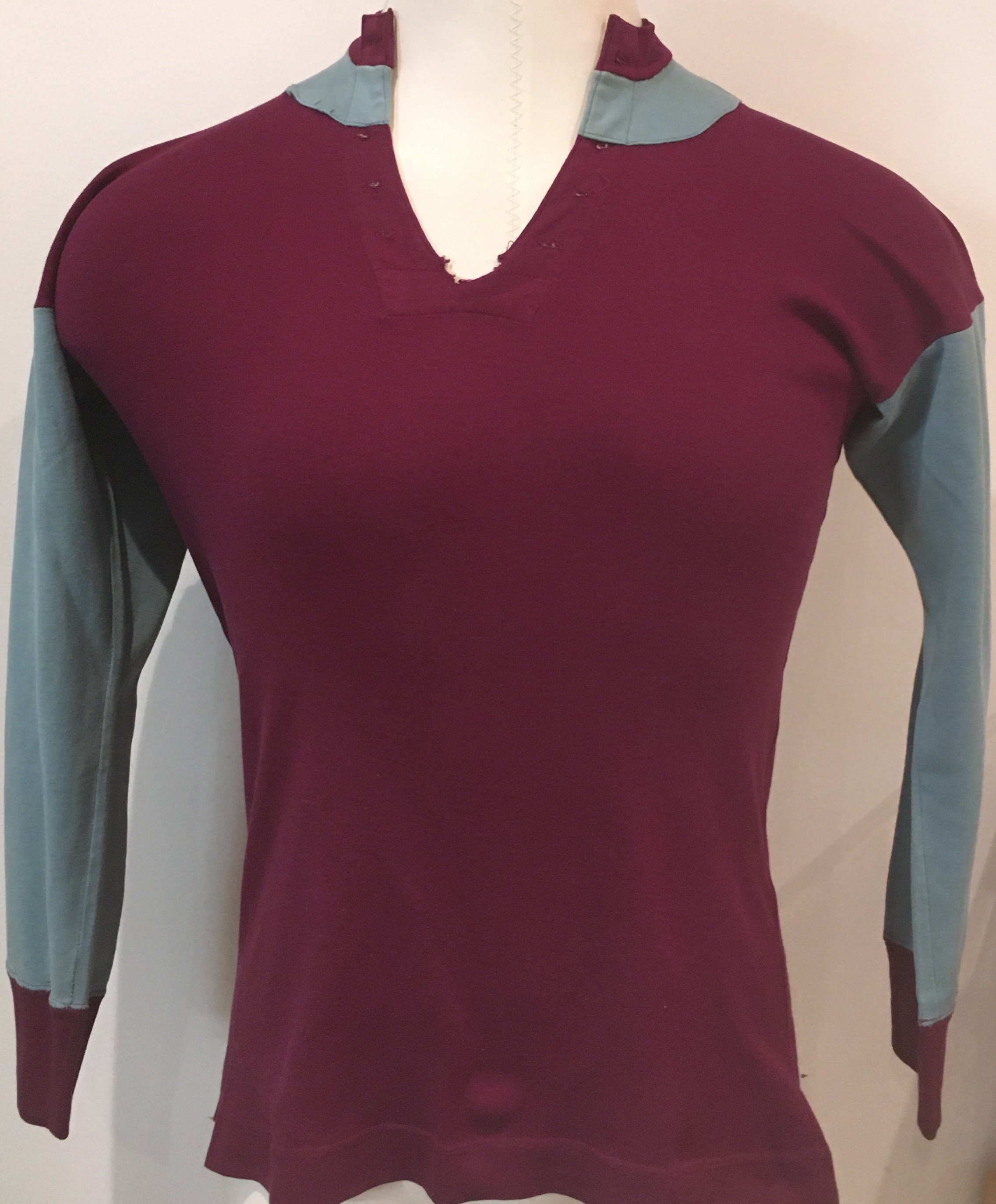 1937 - 1938 West Ham Match Worn Football Shirt: Claret and blue long sleeve Bukta shirt in good condition. Lace neck style but obviously after 88 years the lace is not present but holes where they used to be and a new lace could be easily threaded in. Label states Bukta Arsenal Dylock. Worn by Bill Roberts who was at the club for a few years but only played a few times for the first team as was Len Gouldens understudy. Roberts wore this in reserve matches also. COA from Bills son. Please note pictures online of Bill wearing the kit remain with family and are not included.