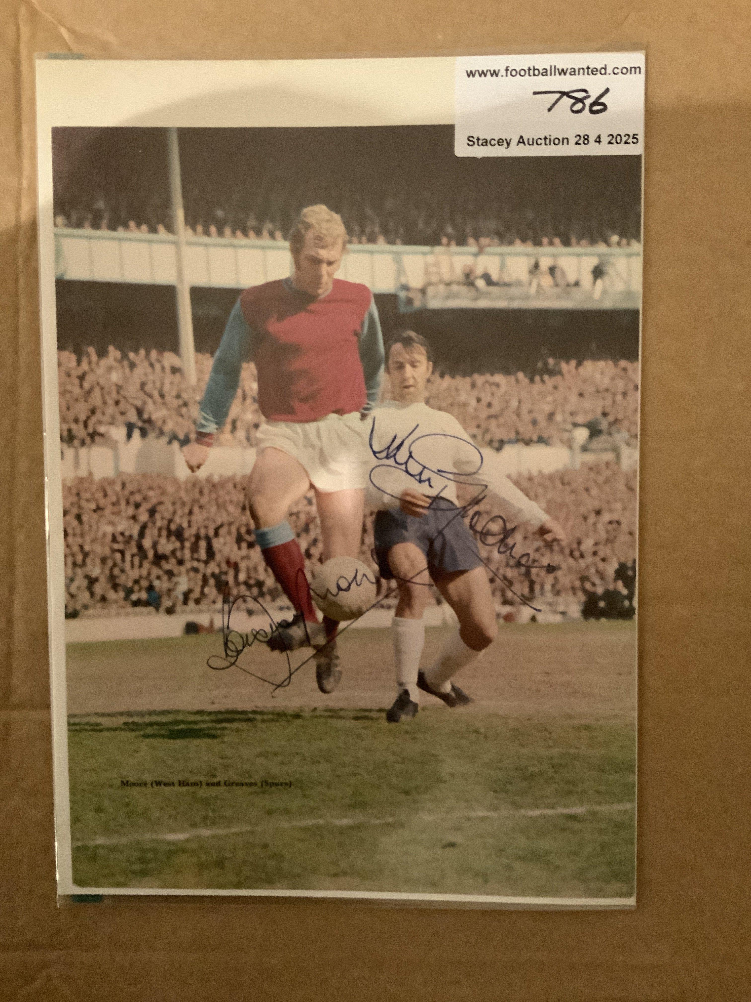 Bobby Moore West Ham + Jimmy Greaves Tottenham Signed Picture: Stunning colour full size magazine picture with clear genuine undedicated autographs in biro of the both.