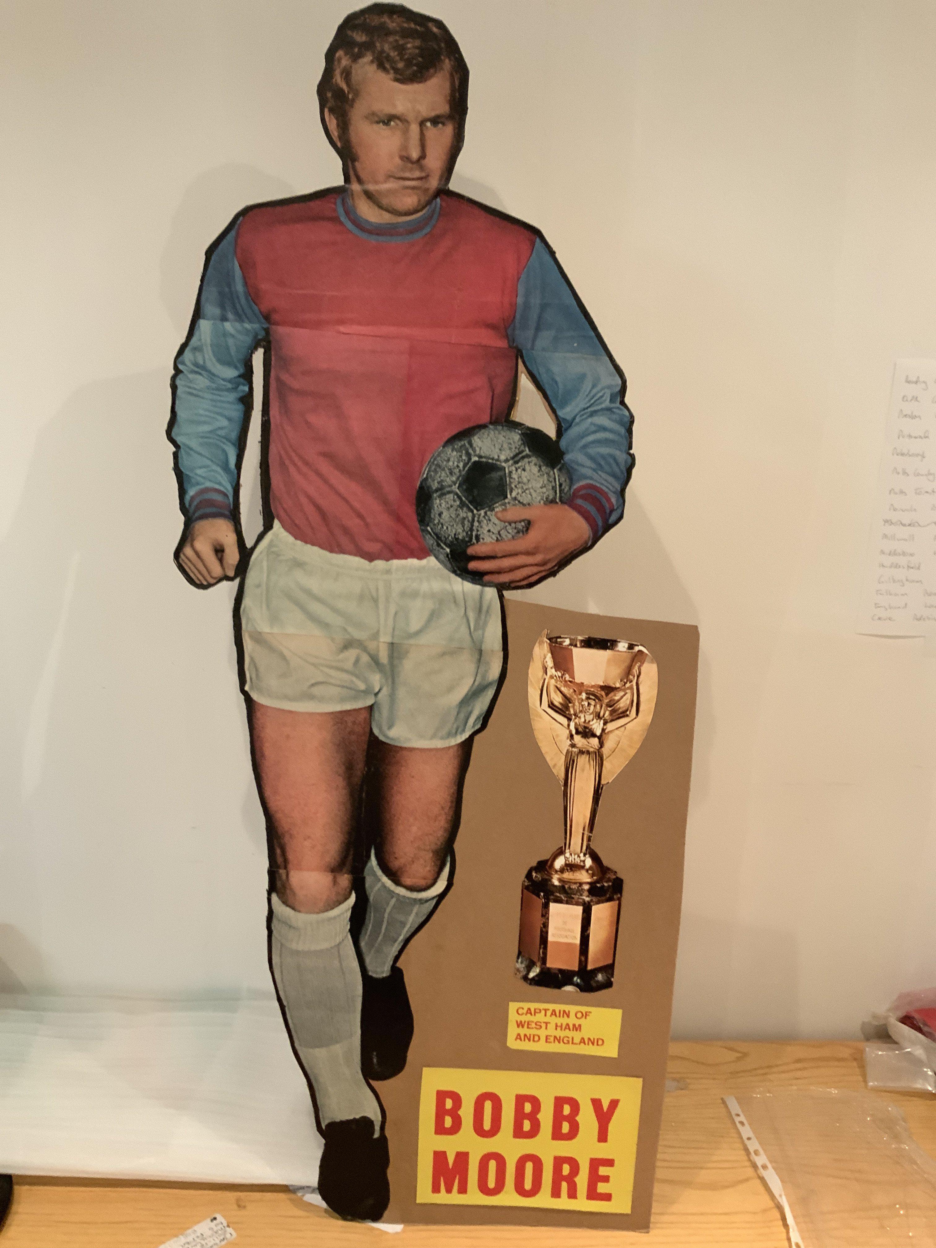 Bobby Moore Magazine Promotion Large West Ham Figure: 42 inch high cardboard cut out of Moore in West Ham kit used to promote a magazine in the late 60s. Has Jules Rimet trophy and his name. Rare item.