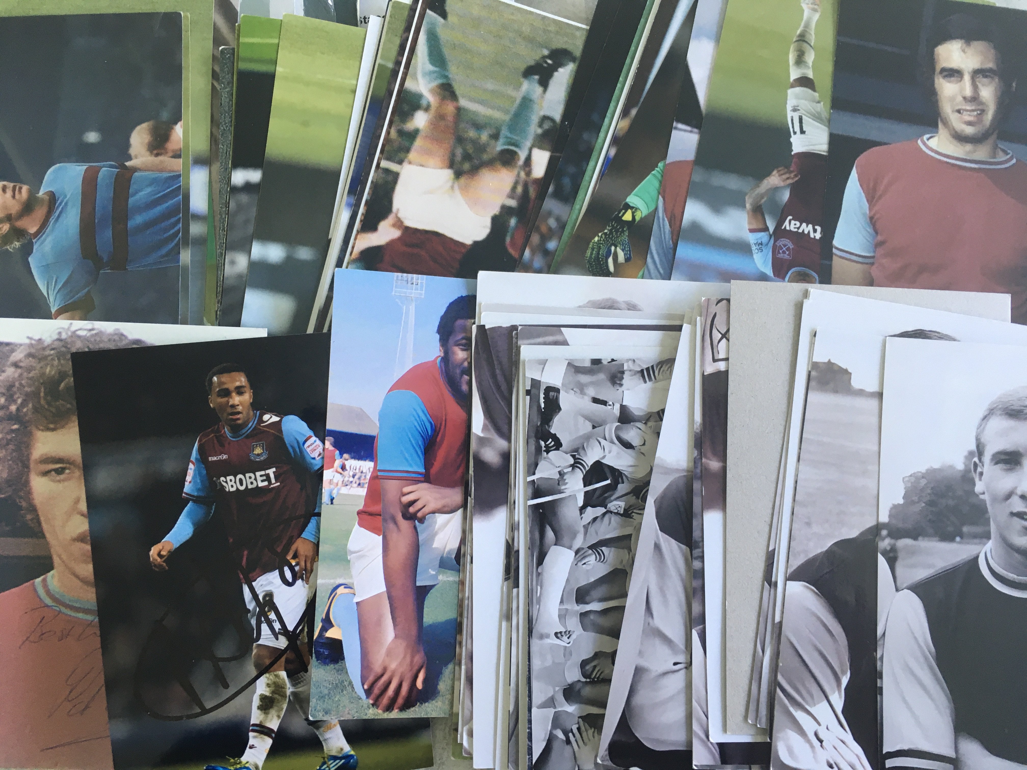 West Ham Football Photos: 6 x 4 inch photos from the 60s to quite recent to include 10 signed. Autographed photos include Marin, Carroll, Ashton, Etherington and Holland. (62)