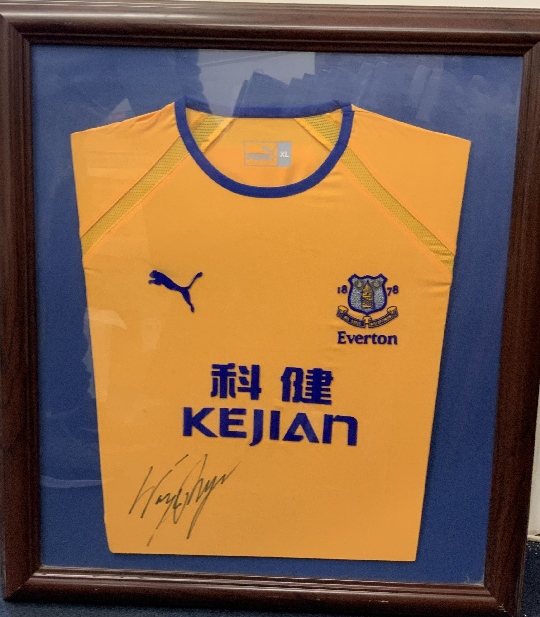Rooney Everton Signed Framed Away Football Shirt: Yellow 2003/04 away shirt signed by Rooney clearly in marker pen. Nicely framed with blue backing card. Not for posting.