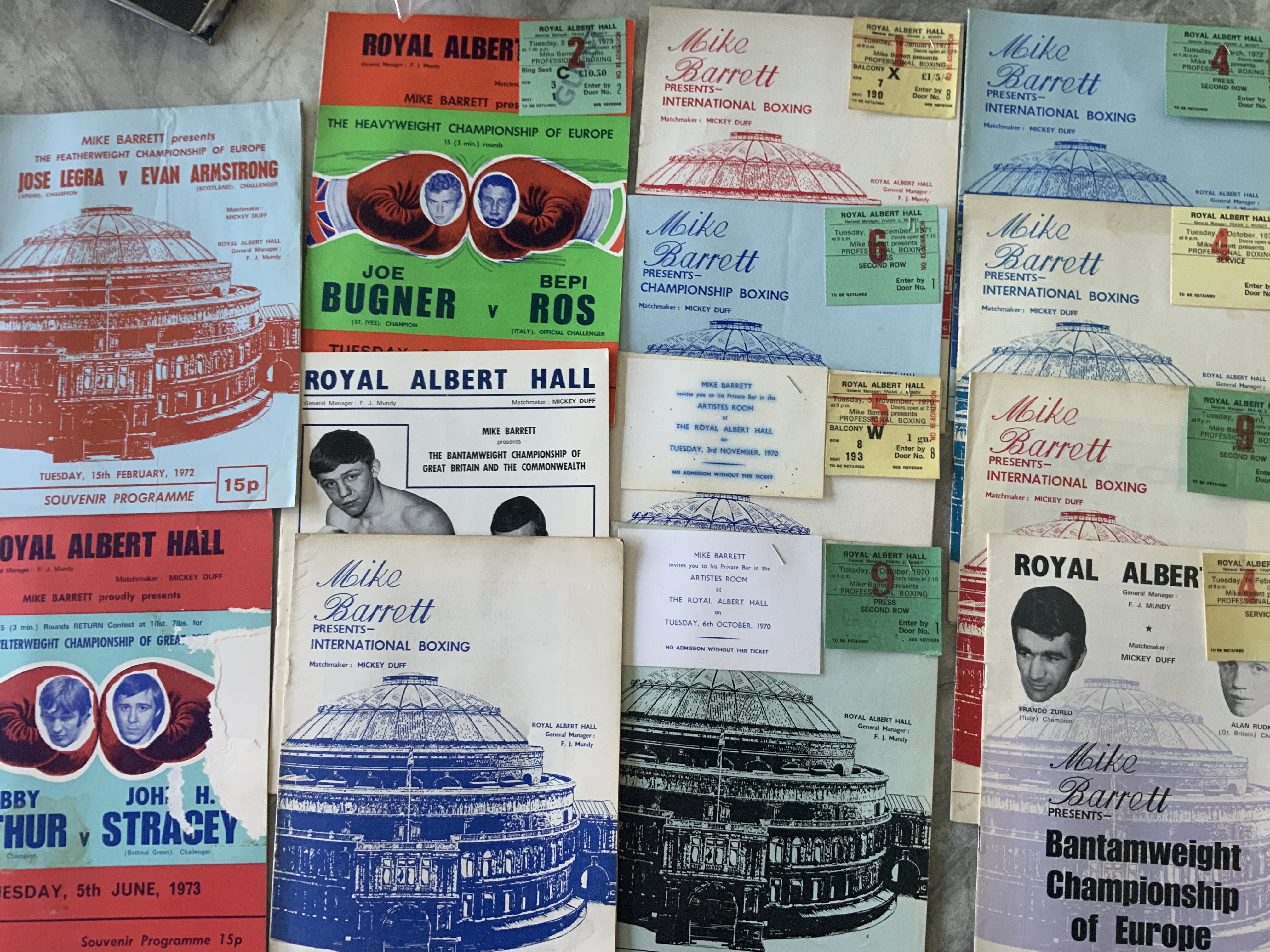1970s Boxing Programmes + Tickets: 14 programmes with 9 tickets stapled to cover. Includes John H Stracey and quite a few of Joe Bugner. Excellent except for one programme.