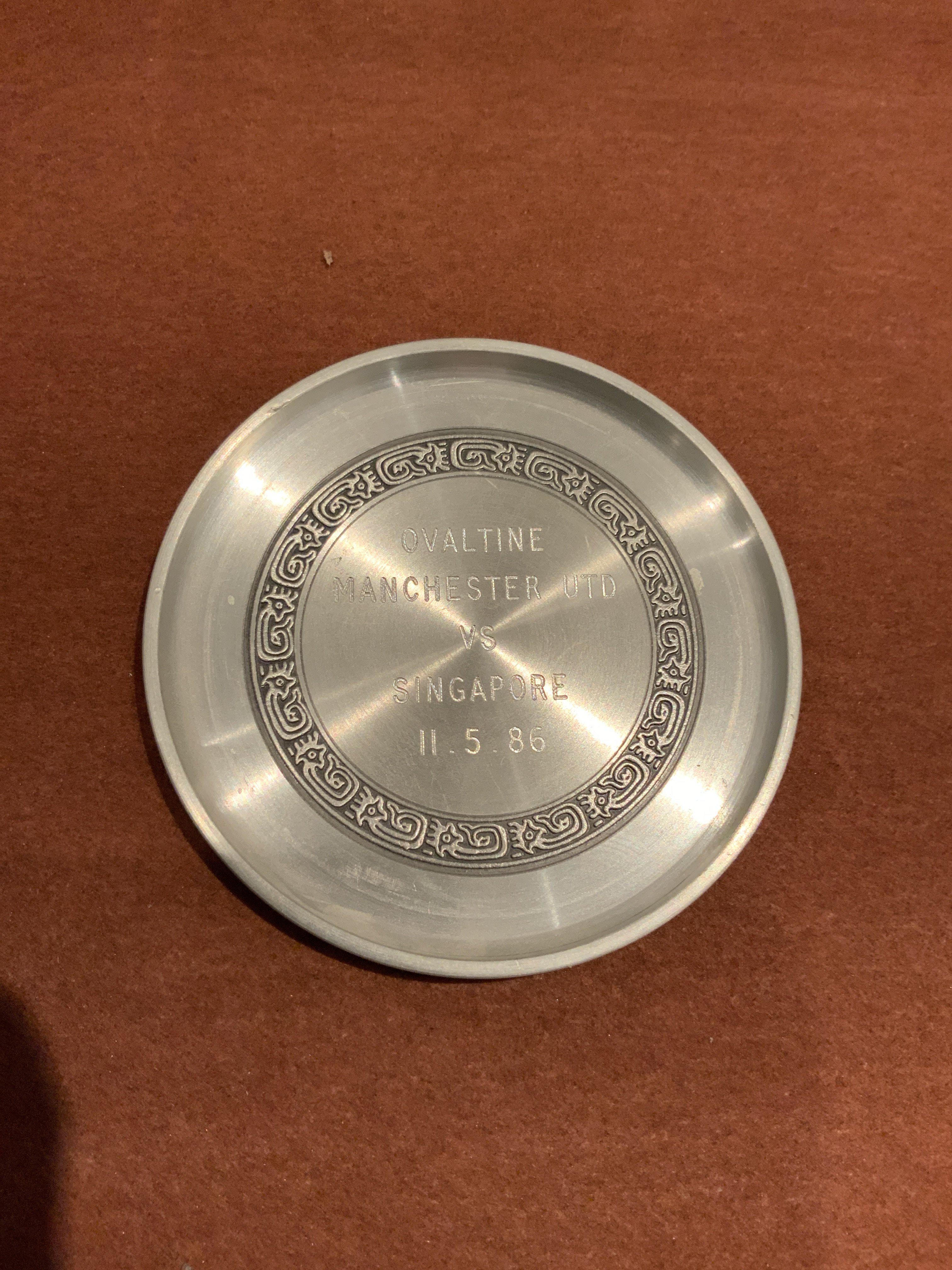 85/86 Singapore v Manchester United Football Medal: 3 inch round pewter medal with match details and dated 11 5 1986. Awarded to a Manchester United player who participated in the match.