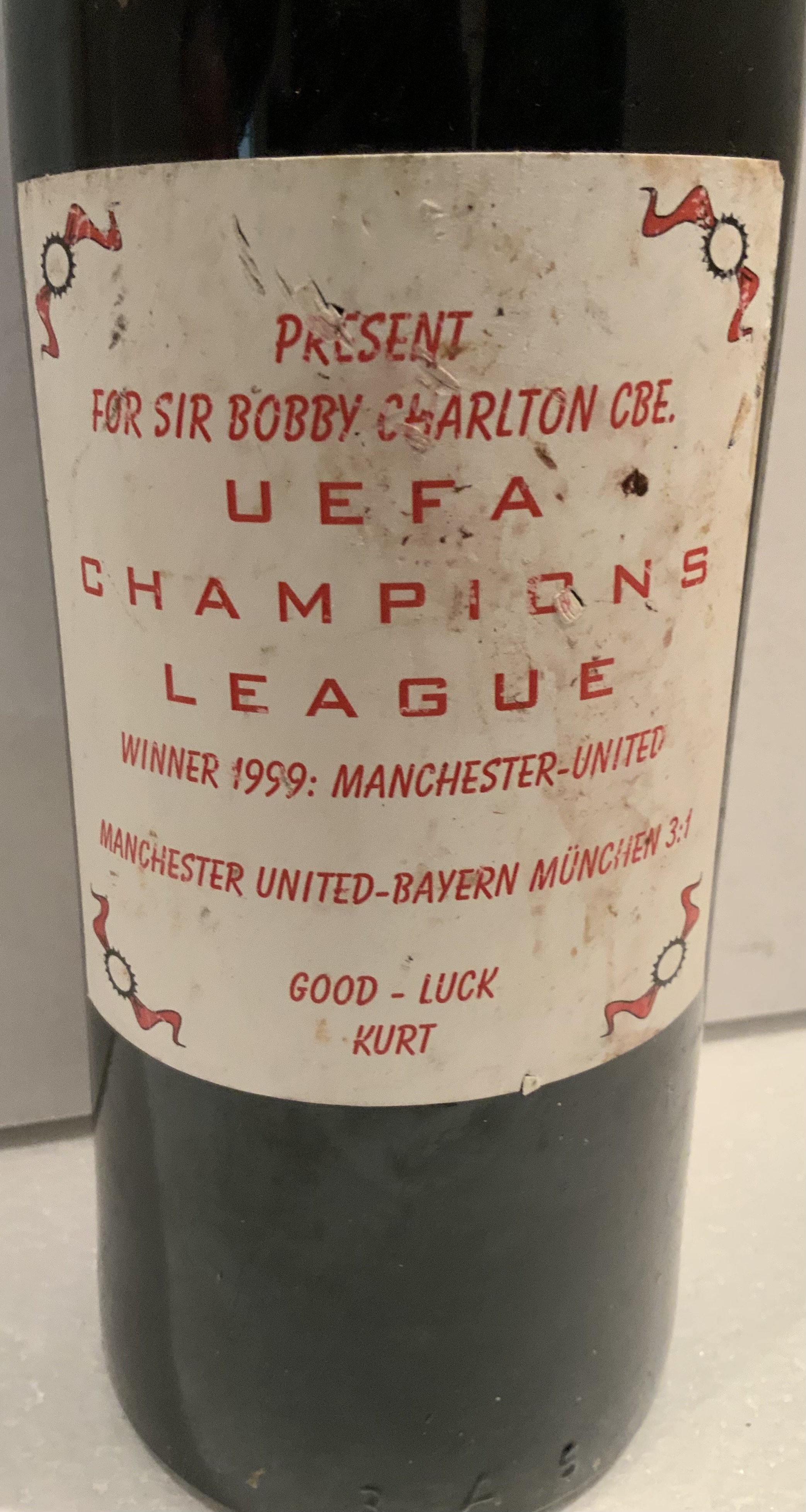 Bobby Charlton Manchester United Bottle Of Wine: Very large Marke 1978 Austrian Chardonnay. Label states Present for Sir Bobby Charlton UEFA Champions League Winners 1999 Manchester United with the score incorrectly printed 3-1. Also Good Luck Kurt.