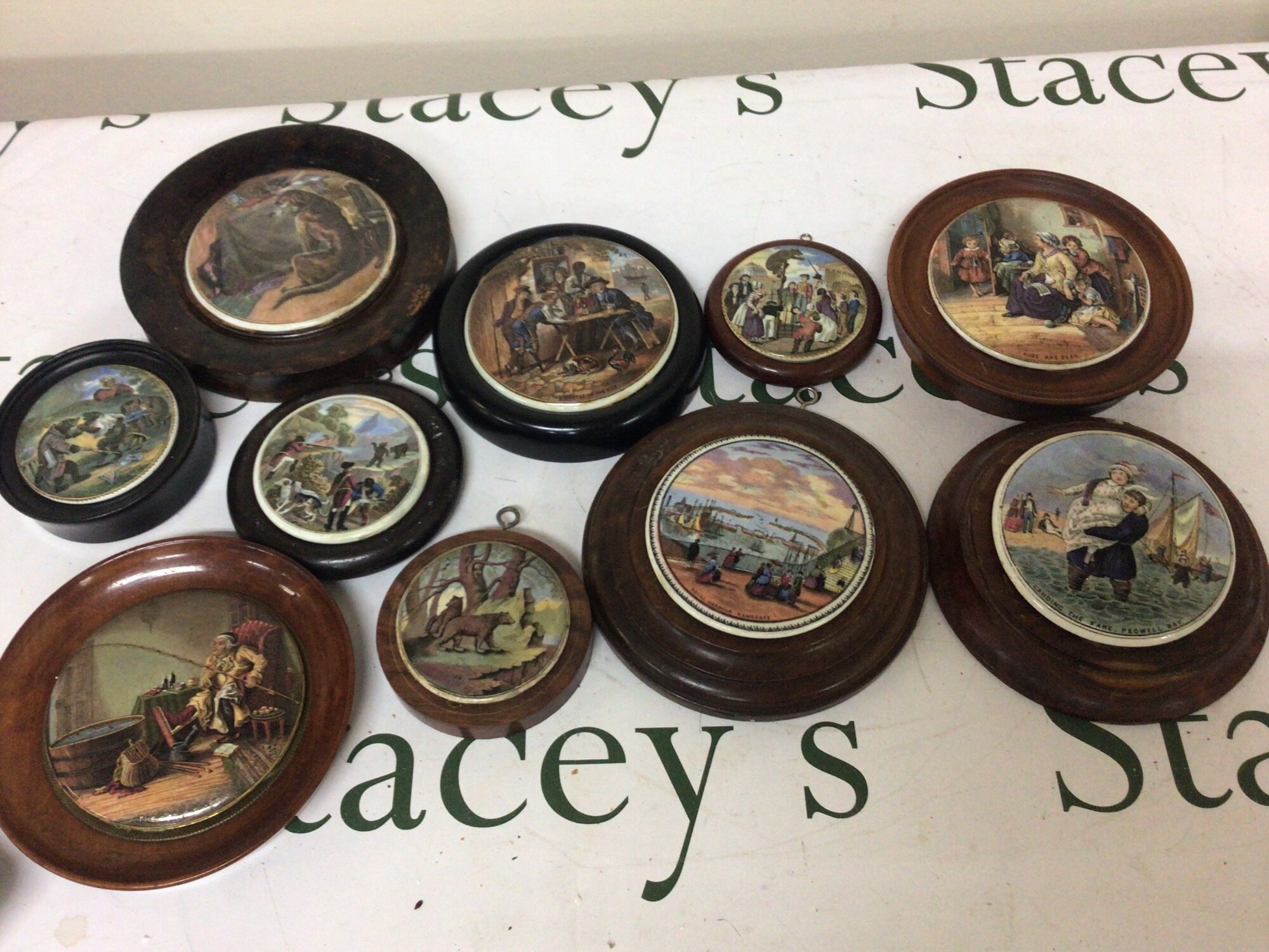 A collection of Victorian pot lids including Landing the Fare Pegwell Bay Royal Harbour Ramsgate The Batgle of the Nile pot lids depicting bears and others. (10) NO RESERVE.
