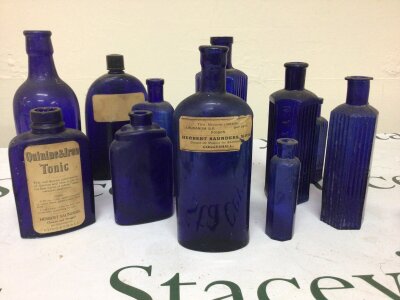 A collection of antique blue glass poison bottles and other tonic and medicine bottles. No Reserve.