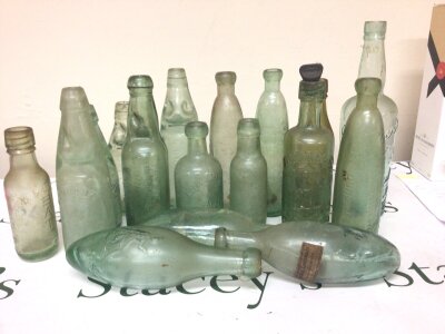 A good collection of Victorian and later glass bottles predominantly Codd bottles most with moulded trade labels including Dunbar & Co Edinburgh CJ Huches Bath Baggs Brothers Portsmouth and many others. NO RESERVE.