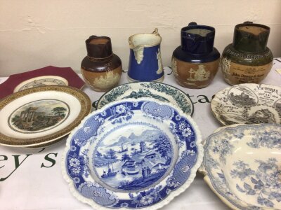 A collection of Doulton stoneware jugs Victorian commemorative plates blue and white plates and others. NO RESERVE.