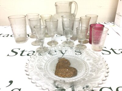 A collection of Victorian and earlier glass some with acid etched lettering a Victorian glass dish water jug and others.