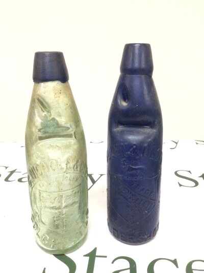 A Rare Antique Blue painted glass bottle Allen & Lloyd Aldershot and one with a blue glass rim C Nicholas &Co Colchester (2) NO RESERVE.